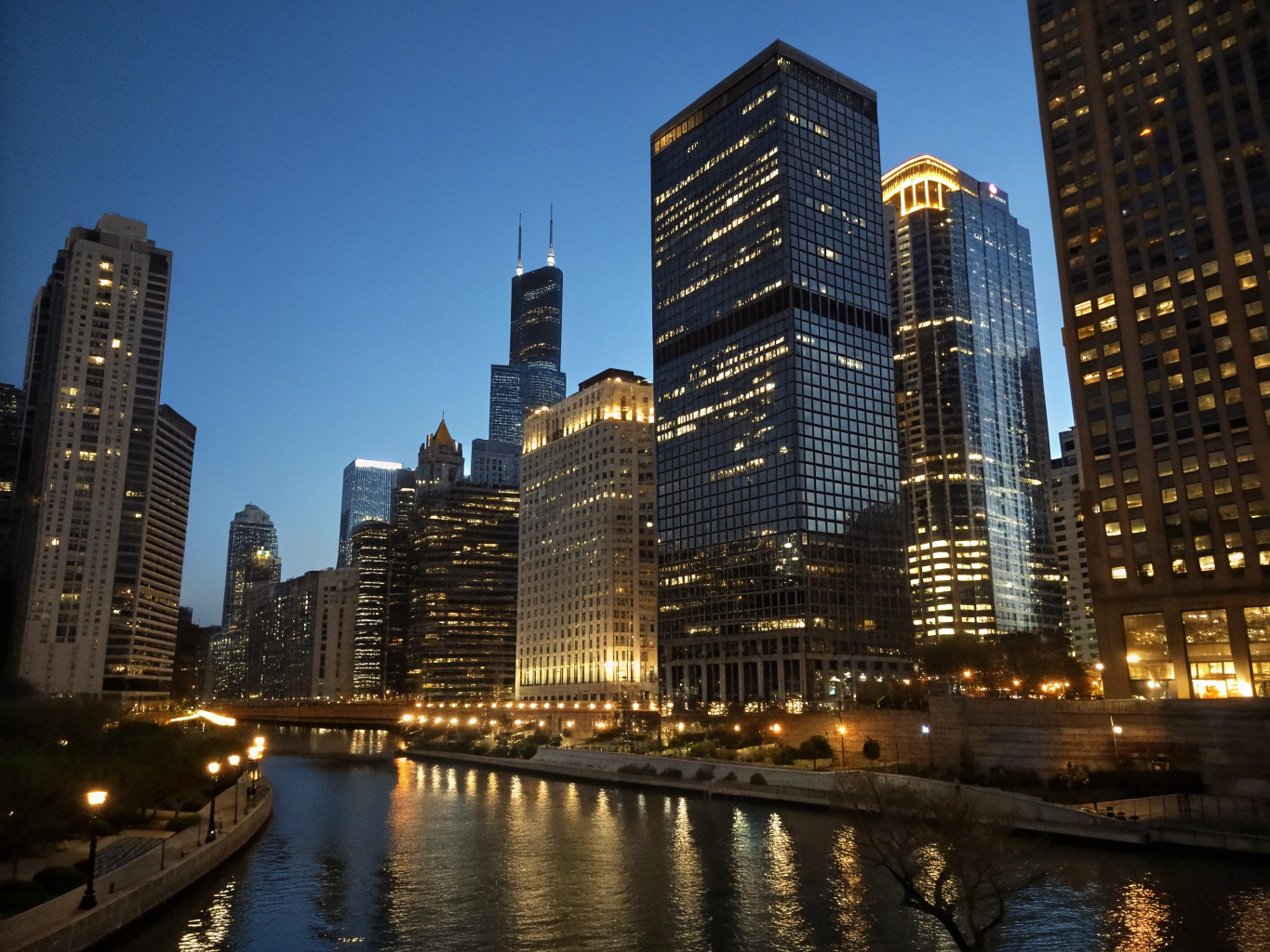 A city skyline illuminated at dusk